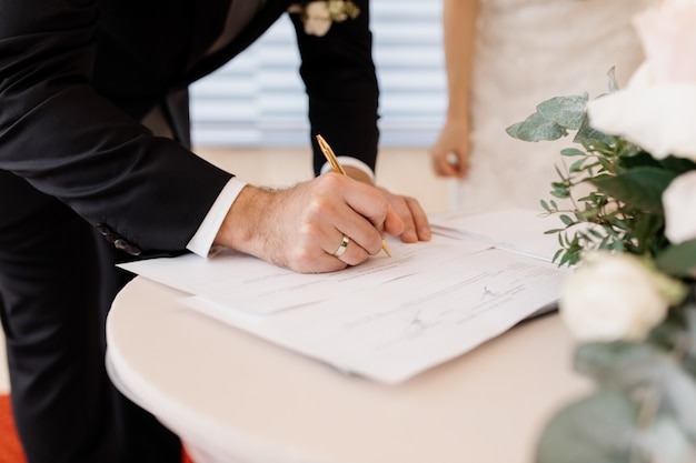 couple in love is signing official marriage documents
